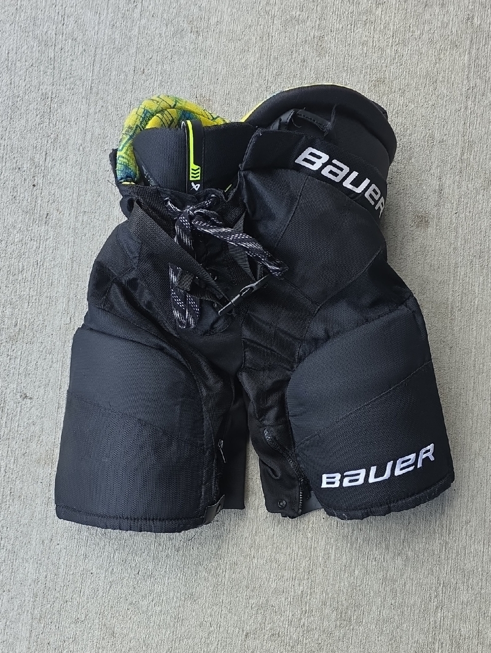 Bauer Black Hockey Pants with Neon Yellow Interior